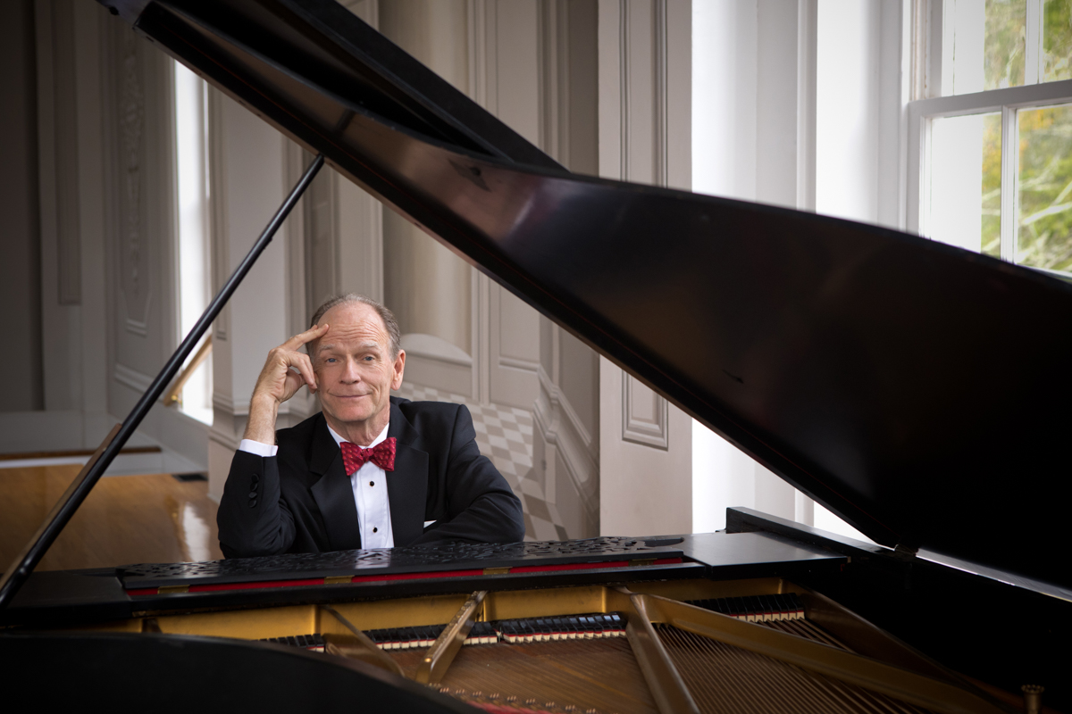 Livingston Taylor at piano, wearing tux