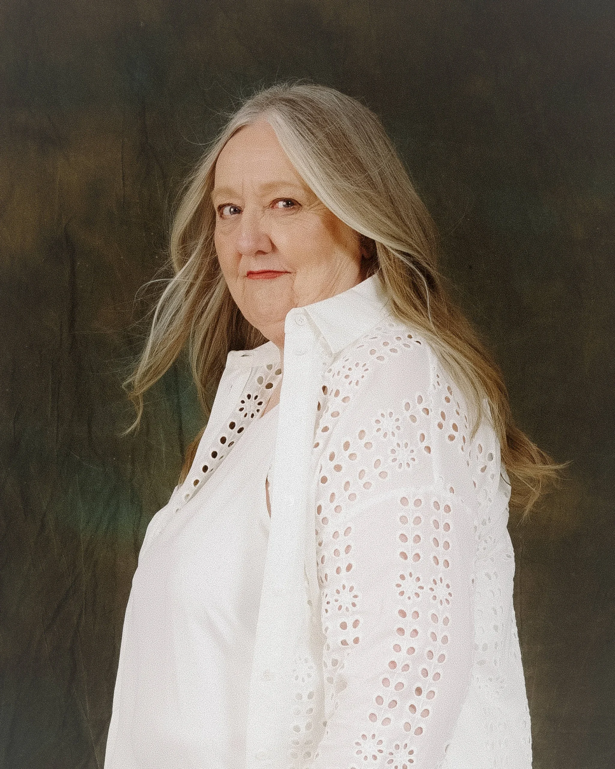Connie Kalder studio photo. She is looking over her shoulder.